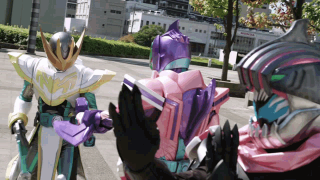 a group of superheros are standing in front of a building that says honda