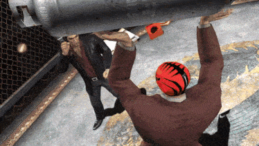 a man in a suit is standing next to a man wearing a red bowling helmet
