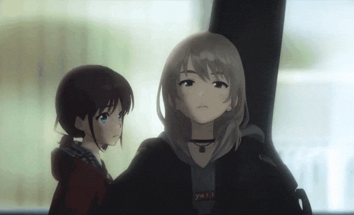 two anime girls are standing next to each other with one wearing a shirt that says " yell "