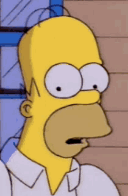 a close up of homer simpson 's face with big eyes