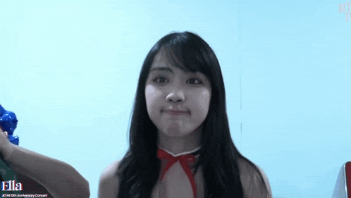 a girl in a red dress with the word ella on the bottom