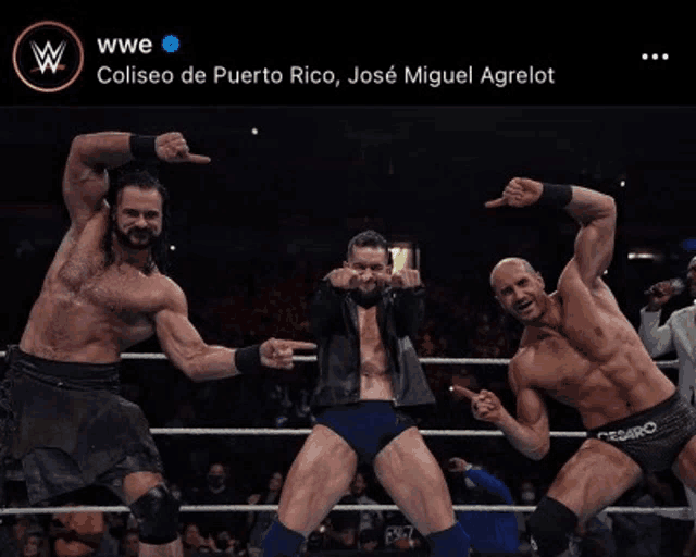 three wrestlers are posing for a picture in a wrestling ring and the caption says coliseo de puerto rico