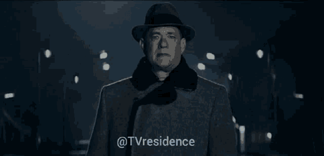 a silhouette of a man standing in front of a fence with the words @tvresidence written below him
