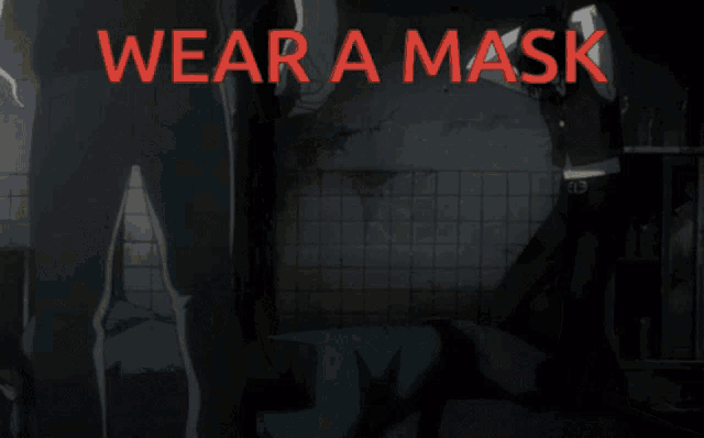 a sign that says wear a mask with a picture of a person