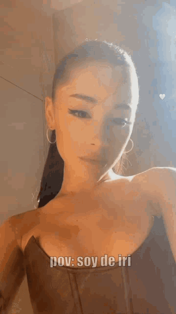 a close up of a woman 's face with the words pov soy de iri above her
