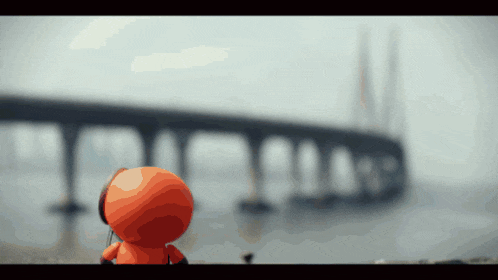 a cartoon character is looking at a bridge over the ocean