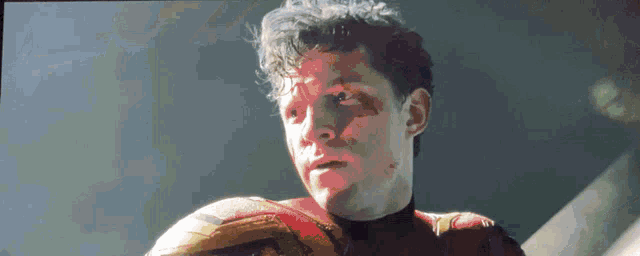 a pixelated image of a man in a superhero costume looking up
