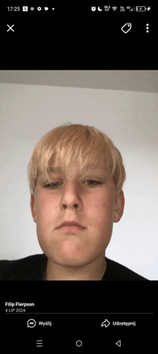 a phone screen shows a picture of a young man named filip flerpson
