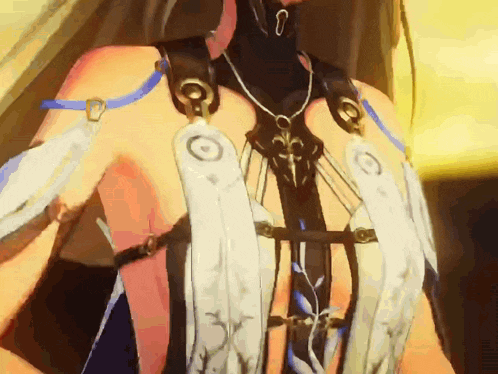 a close up of a woman 's torso with a necklace and feathers on it