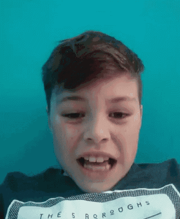 a young boy wearing a shirt that says the sboroughs