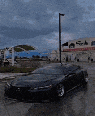 a car parked in front of a building that says soak