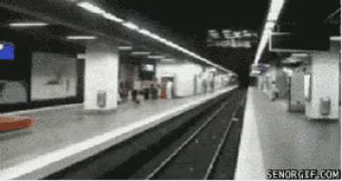 a blurred image of a train station with senorgif.com written on the bottom right