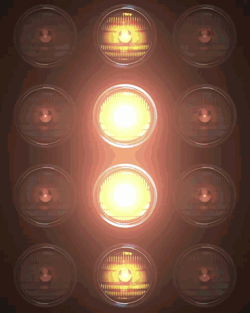a bunch of lights are lit up and one of them has a yellow light coming out of it
