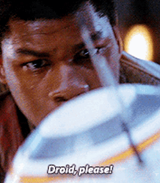 a close up of a man 's face with the words " droid please " on the bottom