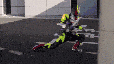 a man in a superhero costume is running on a street