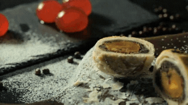 a close up of a dessert with powdered sugar on top