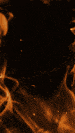 a blurred image of a person standing in front of a fire with a dark background