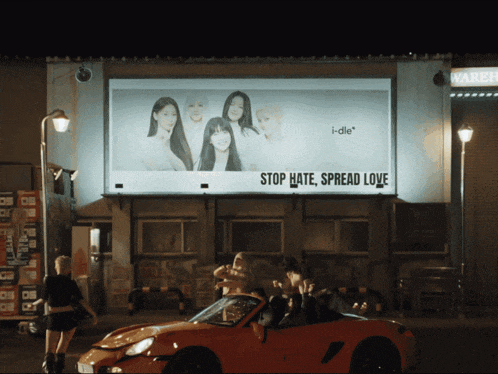 a billboard says stop hate spread love on it