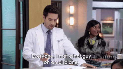 a man in a lab coat says " everyone i met a hot guy on an airplane " while standing next to a woman