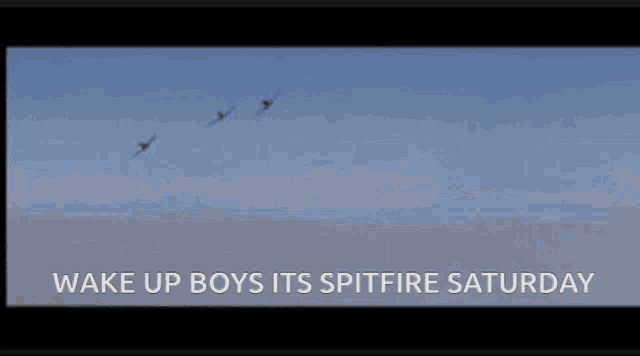 two fighter jets flying in the sky with the words wake up boys its spitfire saturday below them