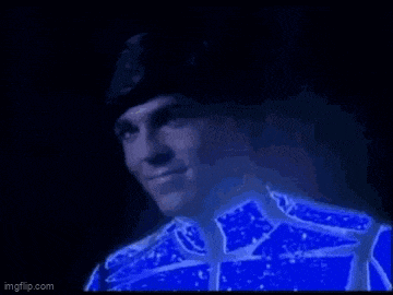 a close up of a person 's face with a blue light coming out of it .