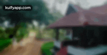 a blurry picture of a house with the words kulfyapp.com in the corner .