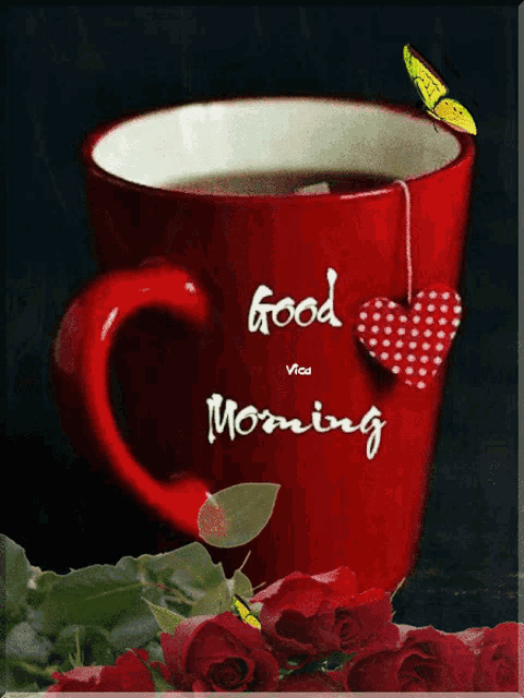 a red cup with a heart hanging from it and the words good morning