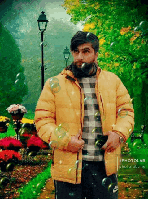 a man in a yellow jacket is surrounded by soap bubbles in a photo taken by photolab.me