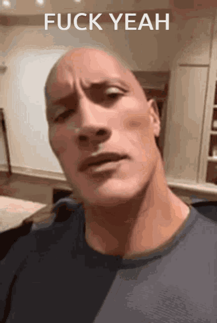 a close up of a man 's face with the words fuck yeah on the bottom