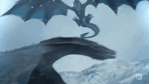 a dragon is flying over a snowy mountain with a gizmo logo in the corner