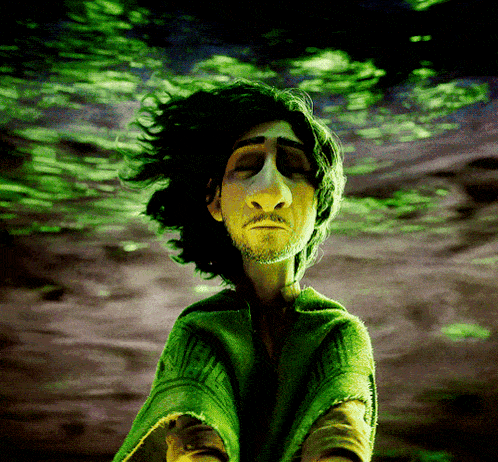 a man with green hair and a beard is looking down