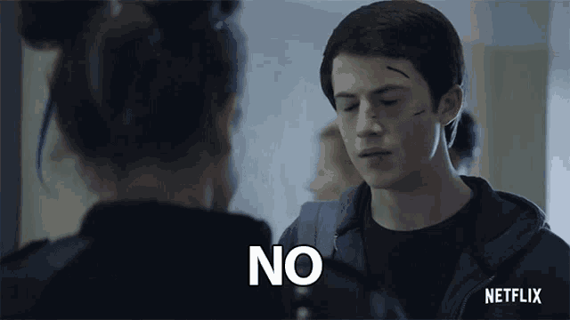 a young man is talking to a girl and says no .