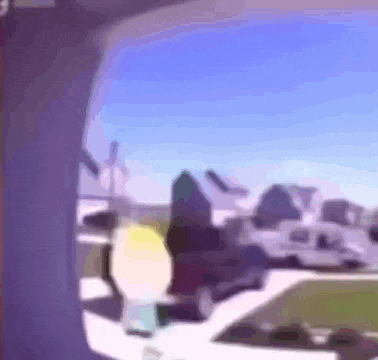 a blurry picture of a house with a blue sky