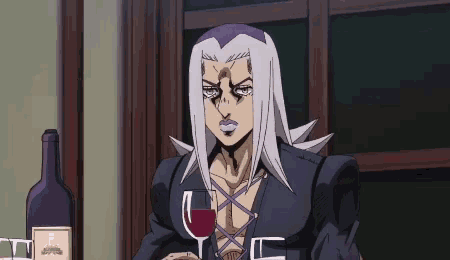 a man in a black jacket is holding a glass of wine