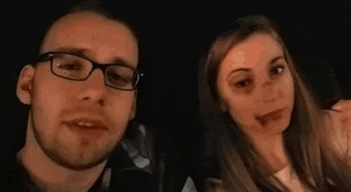 a man and a woman are posing for a picture with their faces painted like zombies