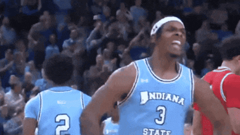 a basketball player wearing a light blue jersey with the number 3 on it