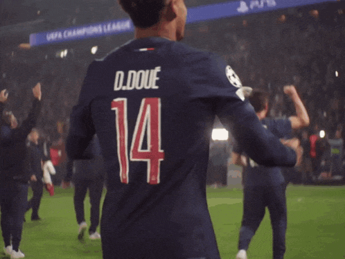a man wearing a jersey with the number 14 on it