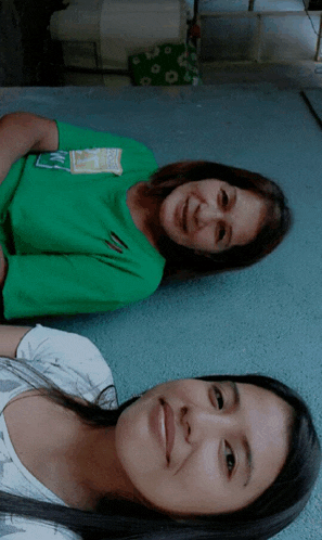 a woman in a green shirt with the letter n on it