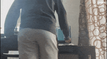 a man standing in front of a computer with the word luma on the bottom