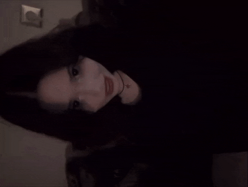 a blurry picture of a woman 's face with a circle in the background