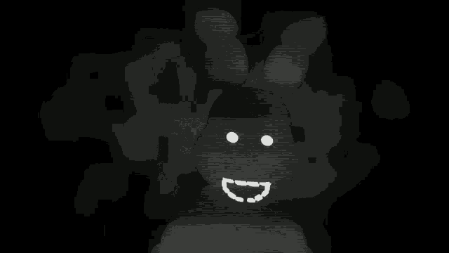 a black and white image of a rabbit with a smiling face .
