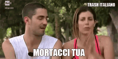 a man and a woman are sitting next to each other and the woman says mortacci tua