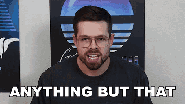 a man with glasses says anything but that