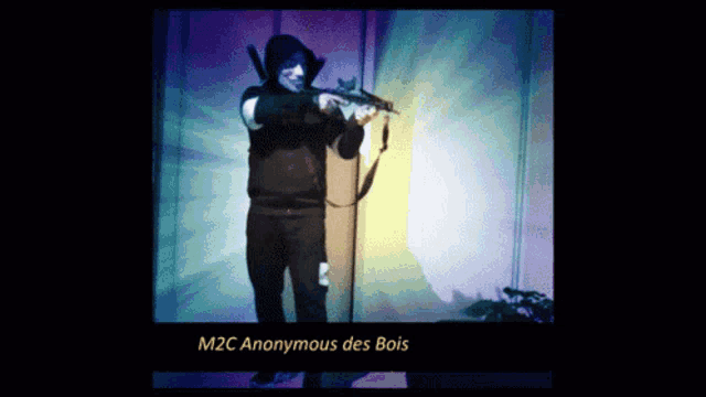 a picture of a man holding a gun with the words m2c anonymous des bois at the bottom