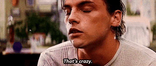 a close up of a man 's face with the words `` that 's crazy '' written on the bottom .
