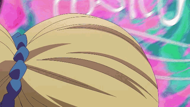 a close up of a person 's hair with a purple ribbon around it