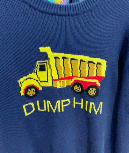 a blue sweater with a dump truck and the words dump him