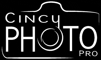 a white logo for cincy photo pro with a picture of a camera .