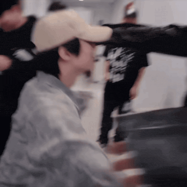 a blurry picture of a man in a baseball cap