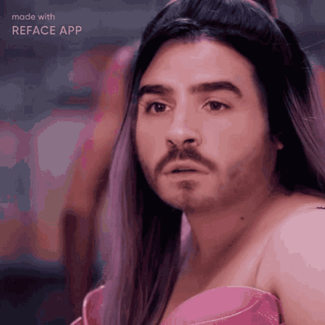 a man with a beard is wearing a pink dress